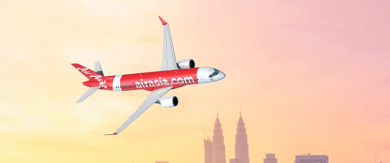 Airbus A220-300 von Air Asia vor der Skyline von Kuala Lumpur: Ab 2028 zu sehen.