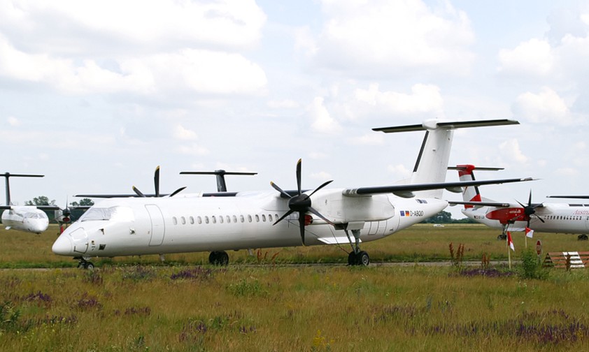 Geparkte De Havilland Canada Dash 8 von Eurowings und AUA: Geringer Nachfrage.