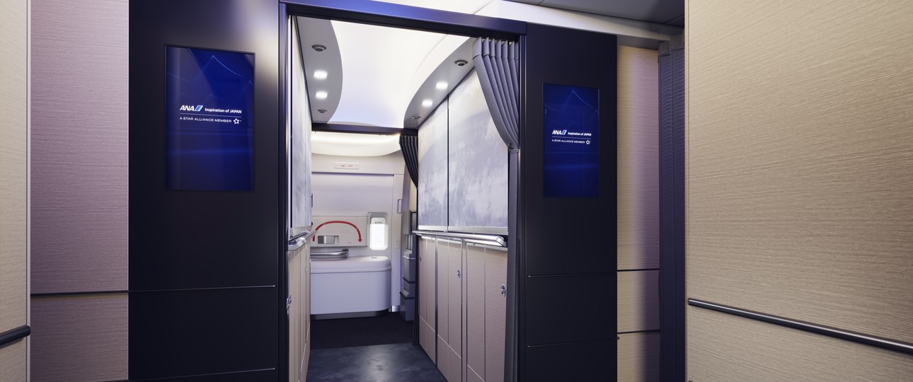 Welcome aboard the new Boeing 777-300ER of ANA. The Entrance should resemble one of a hotel reception