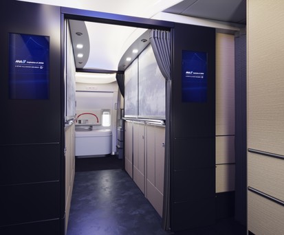 Welcome aboard the new Boeing 777-300ER of ANA. The Entrance should resemble one of a hotel reception