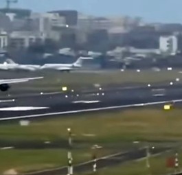 Airbus A320 Neo landet auf Piste, auf der A320 Neo gerade startet
