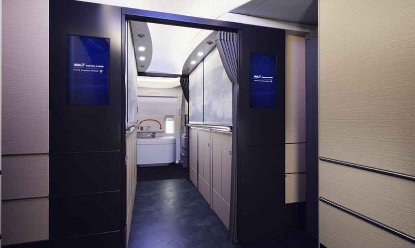 Welcome aboard the new Boeing 777-300ER of ANA. The Entrance should resemble one of a hotel reception