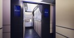 Welcome aboard the new Boeing 777-300ER of ANA. The Entrance should resemble one of a hotel reception