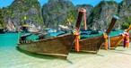 Boote am Strand in Thailand: Drei neue  Fluggesellschaften wollen bald starten.