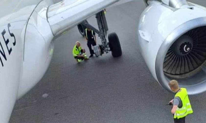 Ein Airbus A320 von Brussels Airlines: Ein Techniker überprüft den geplatzten Reifen.