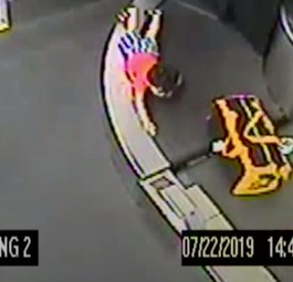 Small boy trapped on luggage belt
