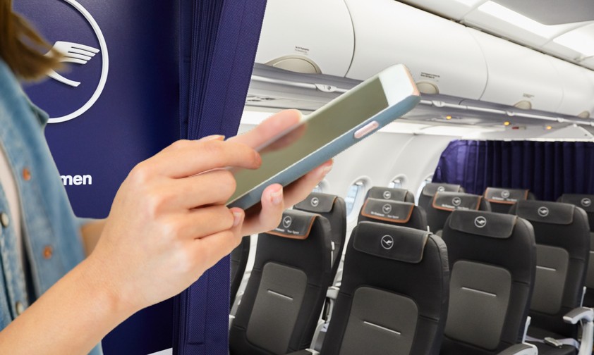 Frau an Bord eines Lufthansa-Fliegers: Künftig immer online.
