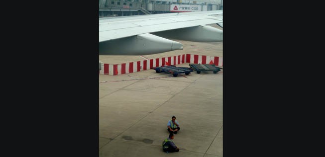 Arbeiter am Flughafen Peking.