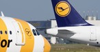 Jets von Condor und Lufthansa: Dienstreisen mit der jeweils anderen Airline gibt es für die Mitarbeitenden bald nicht mehr vergünstigt.