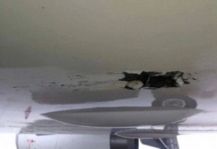 Riss im Rumpf des Airbus A319 von Shenzen Airlines: Das Flugzeug setzte vor Landebahn auf.